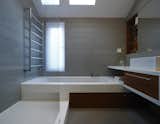 Bath Room, Quartzite Counter, Concrete Floor, Soaking Tub, Undermount Tub, and Enclosed Shower  Photos from Elm Grove