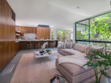 Built in cabinetry throughout blends seamlessly into the open kitchen dining area