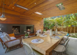 Covered outdoor deck with wood burning fireplace, and heat lamps of course for those chilly nights by the sea