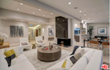 Marble clad fireplace centers the room.