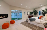 Master bedroom with linear fireplace, and private patio.