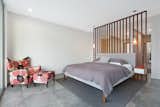 Master Bedroom with Ensuite and Walk-In-Robe behind ironbark timber screen.  Photo 4 of 22 in The Tathra Residence by Wendy Bergsma