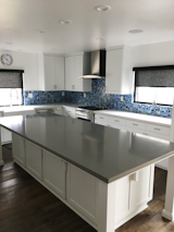 Kitchen, White Cabinet, Dark Hardwood Floor, and Glass Tile Backsplashe  Photo 5 of 7 in Tiffany Inspired Glass Tile Backsplash by Susan Jablon