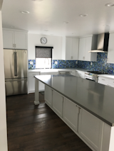 Kitchen, White Cabinet, Dark Hardwood Floor, and Glass Tile Backsplashe  Photo 6 of 7 in Tiffany Inspired Glass Tile Backsplash