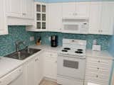 This crisp kitchen features Susan Jablon's Turquoise Blue Mini Subway Glass Tile. Call us if you would like to customize this blend to reflect your kitchen or bathroom colors. http://ow.ly/jAMa30impHd #customtile #tile #mosaictile #glasstile #turquoise #kitchenpics #kitcheninspo #kitcheninspiration #newkitchen #kitchenupdate #kitchenupgrade #caribbeanwaters #caribbeanblue #caribbeangreen #homestyle #interiordesign #homedecor #kitchenideas #kitchencolors #modernkitchen #dreamkitchen #iloveblue #happykitchen #kitchenphotos #customkitchen #kitchenpics #bluetile #kitchentile 