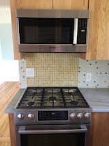 A stunning kitchen renovation using a custom tile creation designed by the customer herself! She used Sku# 1540215 for the walls, which was her own custom tile creation. For the stove backsplash, she used 1" Buttery Yellow Dapple on White Recycled Glass Tile (Sku# 8307089): https://www.susanjablon.com/1-inch-buttery-yellow-dapple-on-white-recycled-glass-tile.html

Laura B. said “Thank you so much, the tile is absolutely gorgeous!” ☺️
#tile #customtile #tiledesign #interiordesign #kitchendesign #customkitchen #kitcheninspo #kitcheninspiration #kitchenremodel #newkitchen #yellowkitchen #colorfulkitchen #mosaictile #glasstile #brightkitchen #homestyle #homedecor #kitchendecor #decor #homedesign #homebeautiful #kitchenpics #beautifulhome #sunnykitchen #kitchenlove #kitchenideas #designideas #homedesign #uniquekitchen #backsplashpics #kitchenbacksplash #backsplash #tiledbacksplash #custombacksplash #colorfulbacksplash #bathroombacksplash