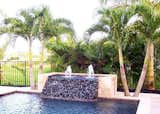 This custom water feature can turn your pool area into a tropical retreat.  Susan Jablon has a multitude of tiles that are rated for outdoor use, including for use in pools, spas, outdoor showers and in outdoor kitchens and BBQ's. Give us a call to assist you in designing your creation, or utilize the Custom Mosaic Designer Tool on our website to get started on creating your dream tile blend: https://www.susanjablon.com/designer.html #susanjablonmosaics#tile #mosaictile #glasstile #customtile #custompool #waterline #customtiledesign #swimmingpoolpic #poolpics #newpool #outdoorshower #swimmingpool #vacationhomeideas #vacationhomepics #tropicalhome #lappoolideas #lappooldesign #familyfunpics #familyfunideas #staycationideas #staycationpics #staycation #designideas #homedesign #homestyle #homedecor #uniquehome #eleganthome #beautifulhome #homebeautiful #outdoortile #waterlinepics #backyarddesign #exteriordesign #susanjablon #poolinspo #designinspo #backyardinspo #outdoorspacedesign #customspa #customfountain #waterfeature #tropicalyard #poolwaterfall #waterfallpics #outdoorbbq #outdoorkitchen #poolinspo #customwaterline #poolwaterline