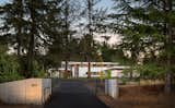 The front entry - pinwheeling concrete forms and laser cut steel panels