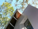 Exterior detail stair tower with metal ribs and hardwood cladding