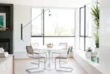 Dining room featuring Saarinen table and RH chairs.