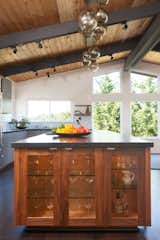 Globe pendants dot the ceiling, bringing the eye up while adding a layer of softness.