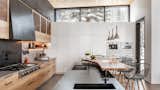 Kitchen, Recessed Lighting, Stone Counter, Range, Undermount Sink, Wood Counter, Range Hood, Wall Oven, Pendant Lighting, and Wood Cabinet  Photo 6 of 7 in Wedge House by CCY Architects