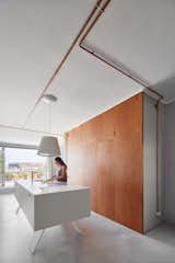 Kitchen, Engineered Quartz, Pendant, Wine Cooler, Concrete, Wall, Ceiling, Drop In, and White  Kitchen Wine Cooler Ceiling Drop In Photos from The Marina Apartment