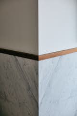 Mitered carrara marble with walnut top-cap