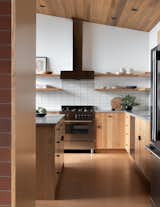 Solid Oak cabinet fronts and natural cork floors give the kitchen organic warmth