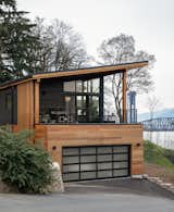 Exterior, Shed RoofLine, Mid-Century Building Type, House Building Type, Shed Building Type, Metal Siding Material, Wood Siding Material, and Metal Roof Material Northwest Modern home with river and bridge views  Photo 1 of 12 in The Wriff Residence by Guggenheim Architecture + Design Studio