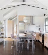 Upcountry Maui Cottage and Barn: Minimalist kitchen with concrete floor and white oak cabinetry