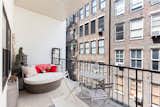 The pièce de résistance is the outdoor space—a balcony beautified with comfortable yet stylish seating and an area rug. 