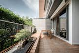 Long bench on terrace with sunken bonsai planter