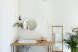 Bath Room, Wood Counter, Pendant Lighting, and Wall Mount Sink Glass bulbs serve as vases and pots for flowers and small plant.  Photos from Love of the simple