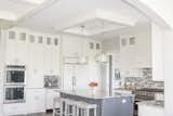 Kitchen ceiling enhancement. Clean white vibe to the island area. 