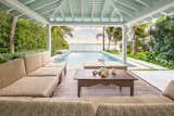 Outdoor covered, seating area complete with an infinity pool and views of the Gulf of Mexico.