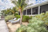 Private beach with native planting allow the owners to watch the sun rise over the Gulf of Mexico at the lush Waterfront Retreat in the Florida Keys.