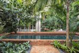 The Old Chicago Brick adds to the feel of 'Old Key West' and the raised coping of the pool helps separate the guesthouse from the main house.