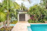 Lush tropical planting not only helps create the Tropical Resort feel that the clients wanted but it also helps for privacy. Powder-coated aluminum was used for the gate so it had less of a visual weight and didn't feel 'heavy'.