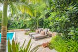 A lounging area was strategically placed near the tropical planting to help provide shade and privacy.
