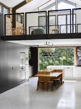Kitchen, Engineered Quartz Counter, Pendant Lighting, Terrazzo Floor, Wood Counter, Track Lighting, Dishwasher, Refrigerator, Wall Oven, and Microwave  Photo 3 of 8 in A Brisbane Architect Designs a Light-Filled Addition For Her Brother