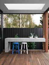 Outdoor, Back Yard, Trees, Decking Patio, Porch, Deck, Wood Patio, Porch, Deck, Vertical Fences, Wall, and Wood Fences, Wall  Photos from A Run-Down Melbourne Bungalow's Makeover Embraces Light and Family Life