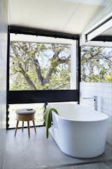 Bath Room, Freestanding Tub, Soaking Tub, and Subway Tile Wall  Emma Janzen’s Saves from An Edgy Slatted Facade Conceals a Striking Indoor/Outdoor Home in Brisbane
