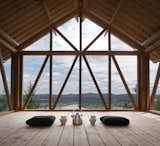 Windows, Wood, and Casement The upper loft is an open-air platform sheltered under the roof, and offers "a peaceful vantage point  Windows Casement Photos from Unwind in a Simple Swedish Cabin With a Meditative Lookout on the Roof