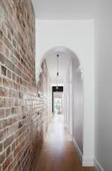 Hallway and Medium Hardwood Floor  Photo 3 of 10 in library by Molly E. Osler, Interior Design from A Streamlined Addition Revives a Gloomy Victorian in Sydney