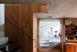 Metal Tread, Metal Railing, Concrete Tread, Hallway, and Medium Hardwood Floor  Photo 9 of 13 in Find Out How a Japanese Architect Created a Fluid Live/Work Space For a Photographer