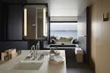 Bath, Drop In, Wall, and Undermount  Bath Undermount Wall Drop In Photos from A Sleek Resort in a Japanese National Park Reinterprets Tradition