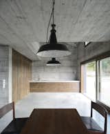Kitchen, Concrete Backsplashe, Concrete Floor, Wood Cabinet, Undermount Sink, Pendant Lighting, and Concrete Counter  Chad Ludeman’s Saves from A Concrete Hideaway in the Italian Countryside