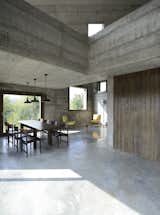Living Room, Chair, Coffee Tables, Pendant Lighting, and Concrete Floor  Photos from A Concrete Hideaway in the Italian Countryside