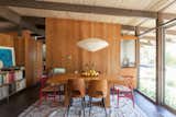 Dining Room, Pendant Lighting, Table, Chair, Rug Floor, and Storage  Photo 1 of 12 in Hole Up in This Quintessential Midcentury Modern Rental in Hollywood