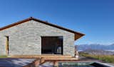 Outdoor, Side Yard, Decking Patio, Porch, Deck, Wood Patio, Porch, Deck, and Small Pools, Tubs, Shower  Photo 9 of 11 in This Modern Stone Cabin Looks Like It Belongs in Middle-Earth