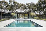 Outdoor, Large Pools, Tubs, Shower, Trees, Concrete Patio, Porch, Deck, Decking Patio, Porch, Deck, Wood Patio, Porch, Deck, and Back Yard  Photos from Recycled Wood Stars in an Ogle-Worthy Renovation in Australia