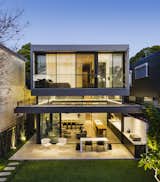 Outdoor, Grass, Back Yard, Walkways, Landscape Lighting, Large Patio, Porch, Deck, and Vertical Fences, Wall  Photos from A Sleek, Two-Story Addition Hides Behind a Traditional Cottage in Sydney