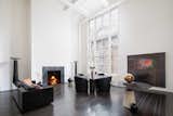 Living Room, Dark Hardwood Floor, Sofa, Wood Burning Fireplace, Floor Lighting, Standard Layout Fireplace, Chair, and Table  Photo 1 of 9 in Legendary Designers Massimo and Lella Vignelli's New York Duplex Is Listed at $6.5M