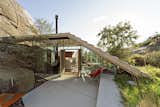 Outdoor, Concrete Patio, Porch, Deck, Shrubs, Slope, Boulders, and Trees  Photo 1 of 8 in This Norwegian Cabin's Roof Doubles as an Observation Deck