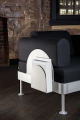 The furniture also comes with a sleek, scalloped magazine rack.
