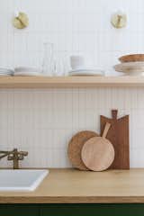 The floating shelf is from Semihandmade, faucet from Homary, and sconces from Cedar & Moss.