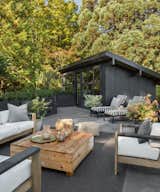 The roof terrace offers an outdoor lounge space, as well as views into the Seattle hills.