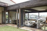 Folding doors make it easy for breezes to blow through the house and cool it naturally.