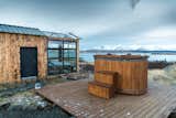 Another one of Panorama Glass Lodge Iceland’s stargazing cabins is just a quick 30-minute drive from Reykjavík at Hvalfjörður (Whale Fjord). The glass-encased vacation rental includes a hot tub, so you can take your stargazing outside.  